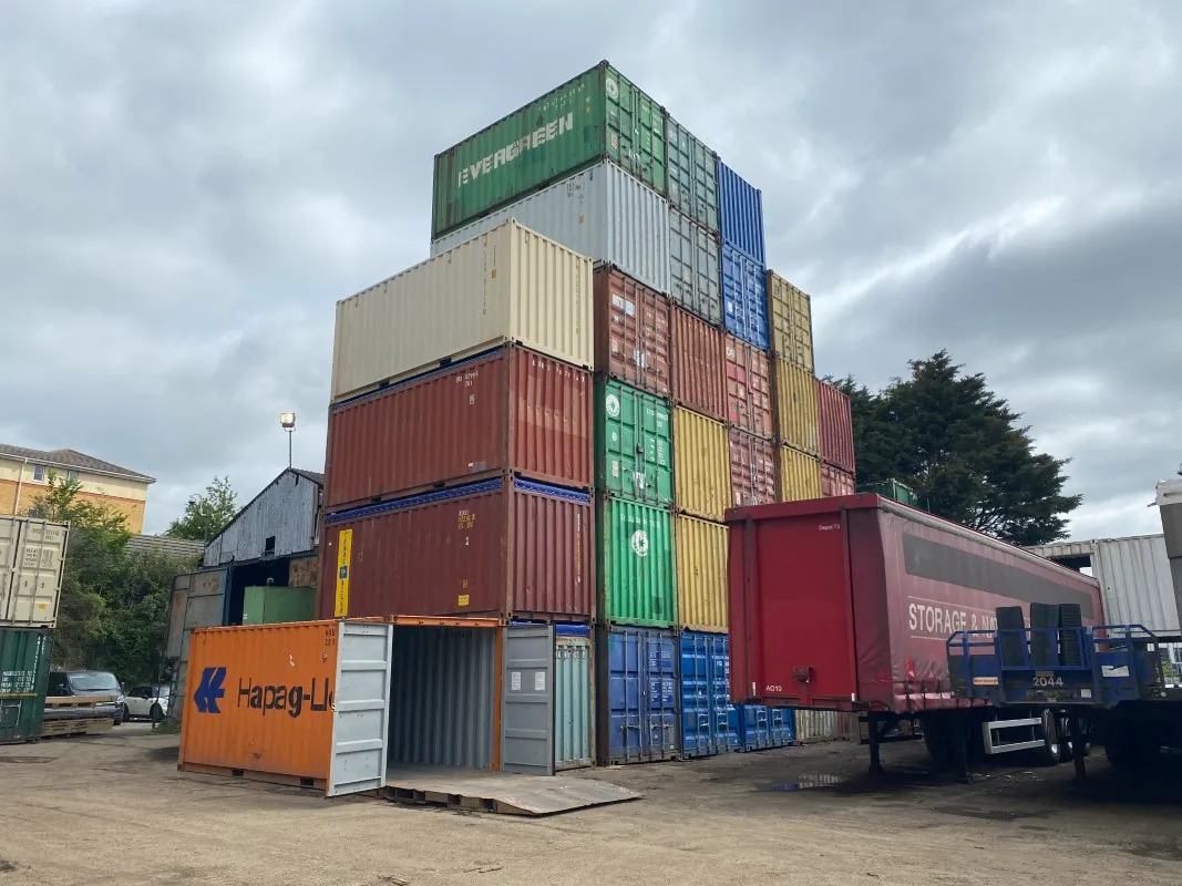 Shipping container depot with stacked hire units ready for transport