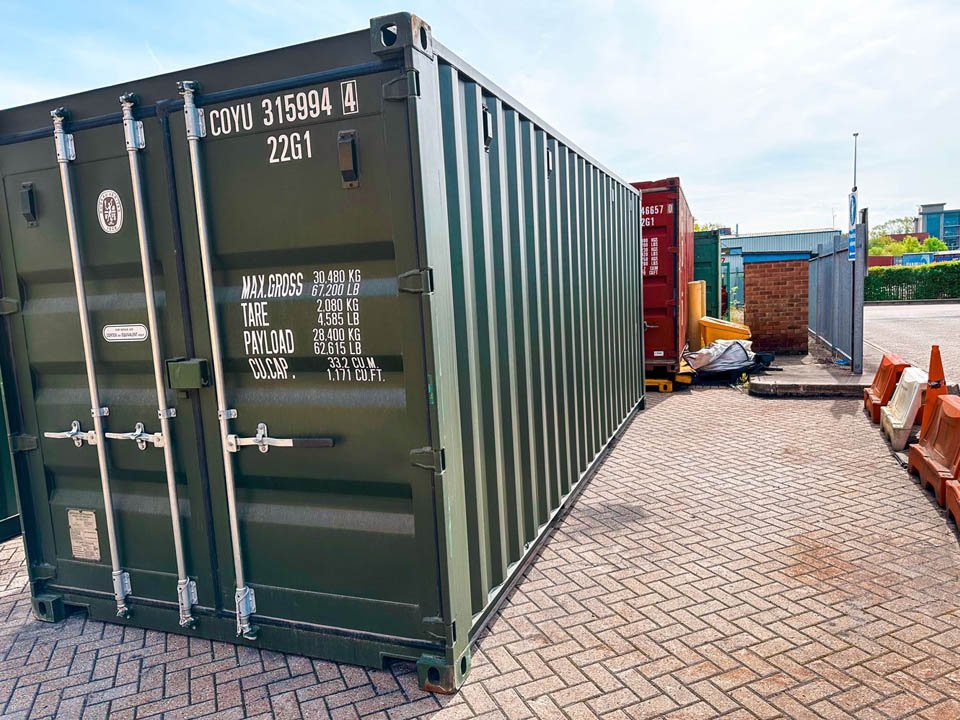 A secure blue storage container in a yard.